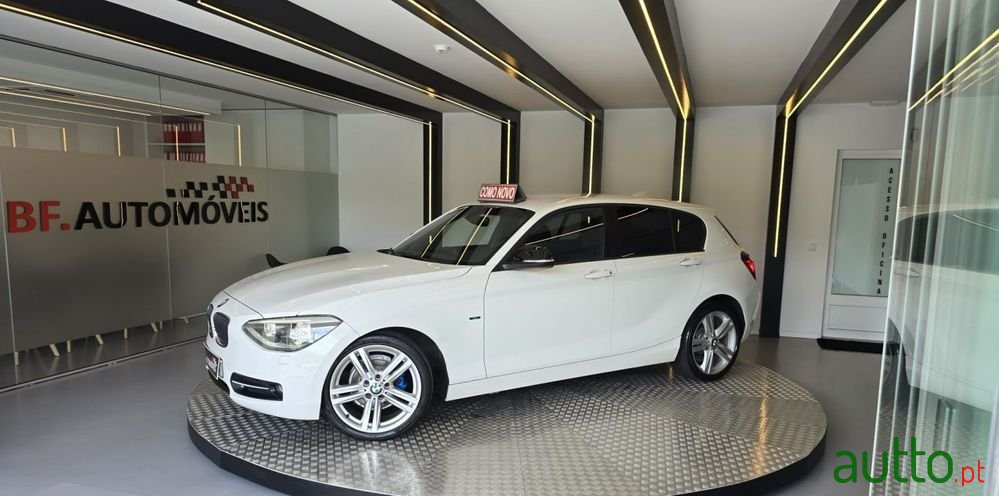 2011' BMW 116 I Line Sport photo #2