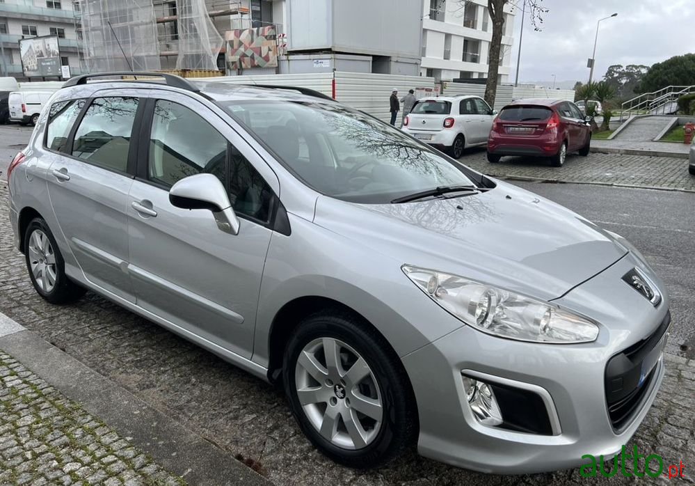 2013' Peugeot 308 Sw photo #1