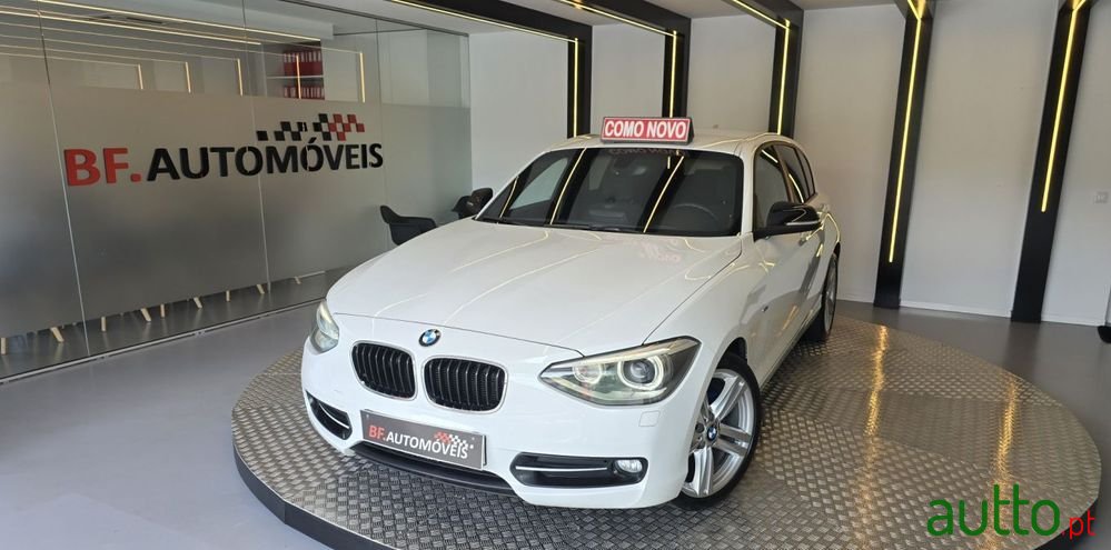 2011' BMW 116 I Line Sport photo #1