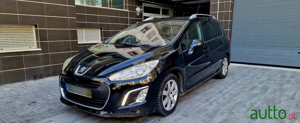 2012' Peugeot 308 Sw photo #1