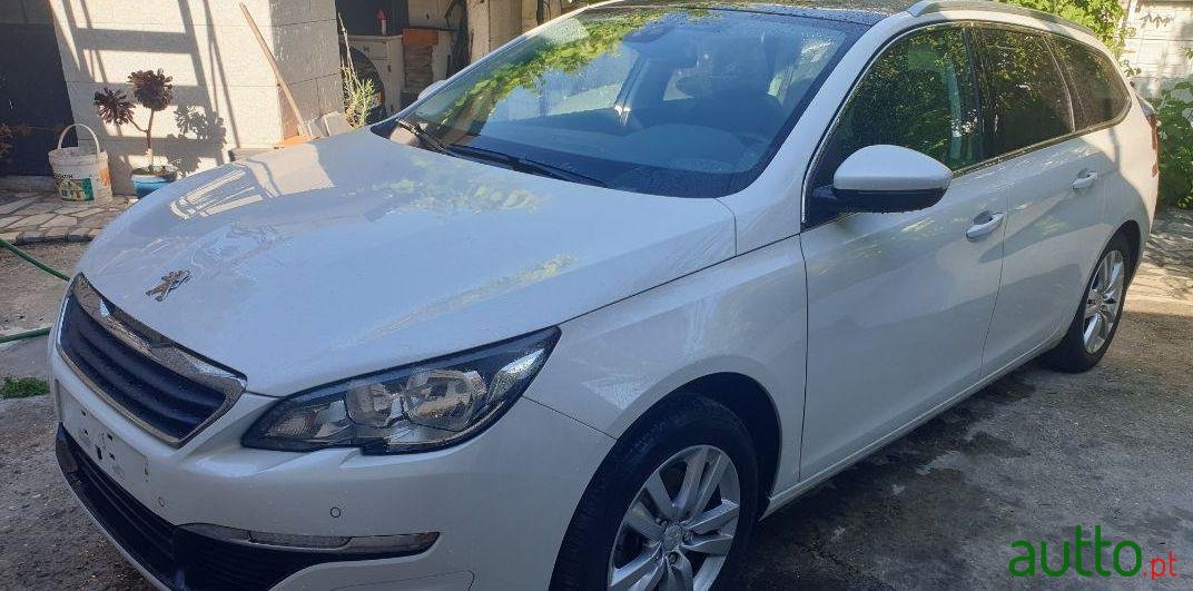 2014' Peugeot 308 Sw photo #1