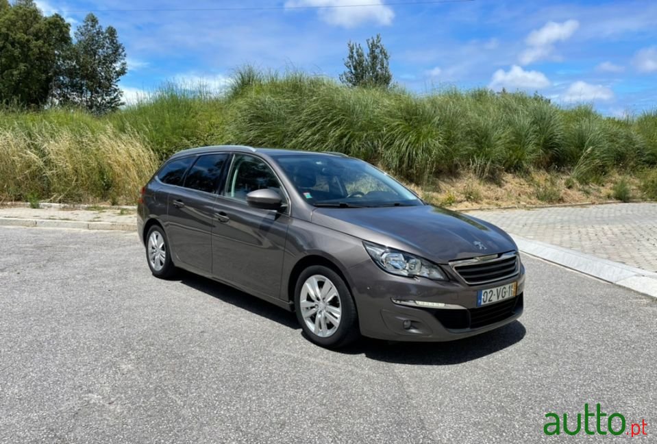 2014' Peugeot 308 Sw photo #1